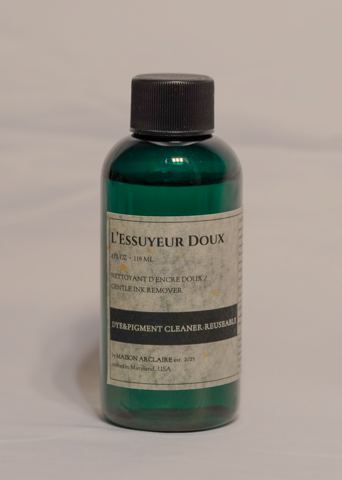 Bottle of 'L'Essuyeur Doux' on a gray background