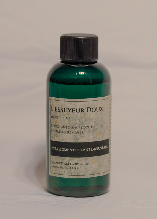 Bottle of 'L'Essuyeur Doux' on a gray background